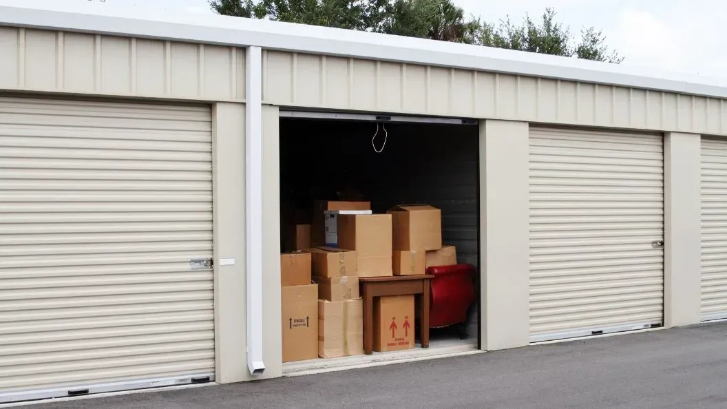 Open storage unit with boxes stacked inside