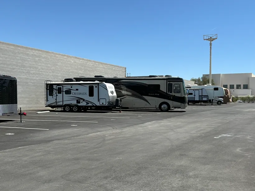 View of outdoor vehicle storage at Mountain Vista Mini Storage facility.