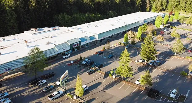 Aerial view of Ken's Korner Mini Storage and shopping plaza.