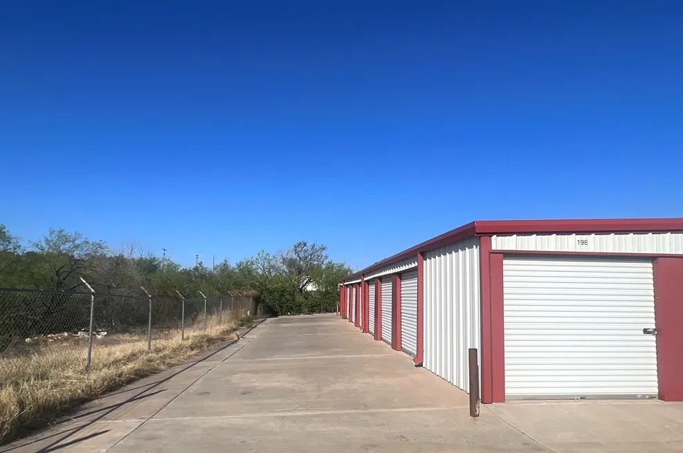 Exterior of outdoor storage at MRC Self Storage facility with paved roads.