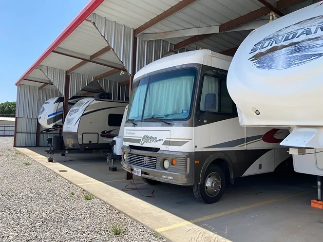 Exterior of covered vehicle storage at North Texas Self Storage facility.