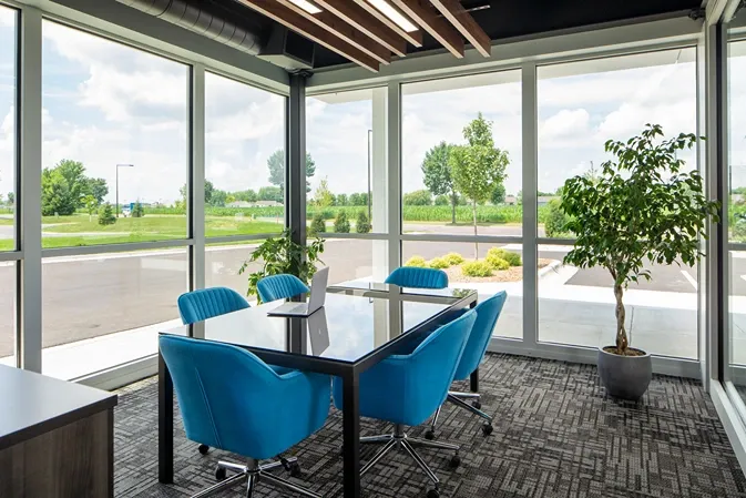 Modern lounge area with table, seating, and ambient lighting at Storage Lounge.