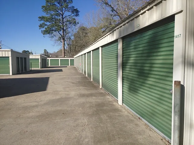 Exterior of Town and Country Self Storage with roll-up doors and paved roads.