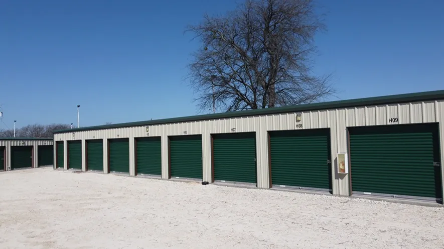Exterior View of Trio Self Storage with roll-up doors and fenced perimeter.